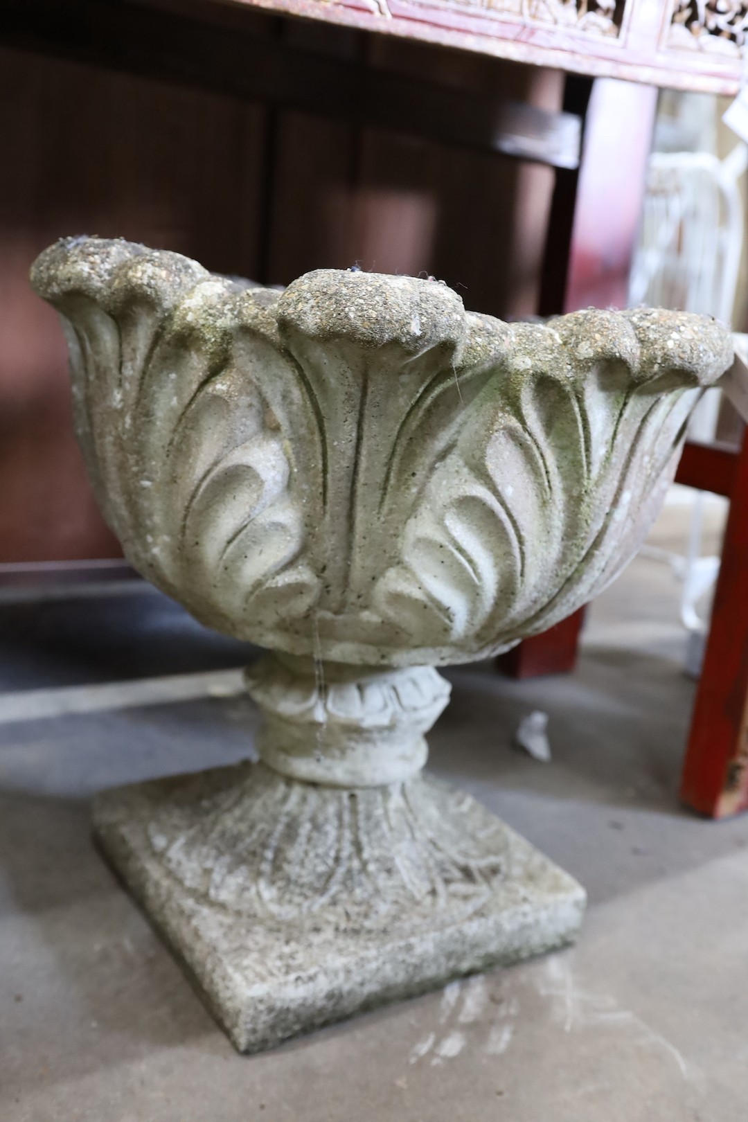 A pair of circular reconstituted stone garden planters moulded with acanthus leaves, diameter 50cm, height 43cm